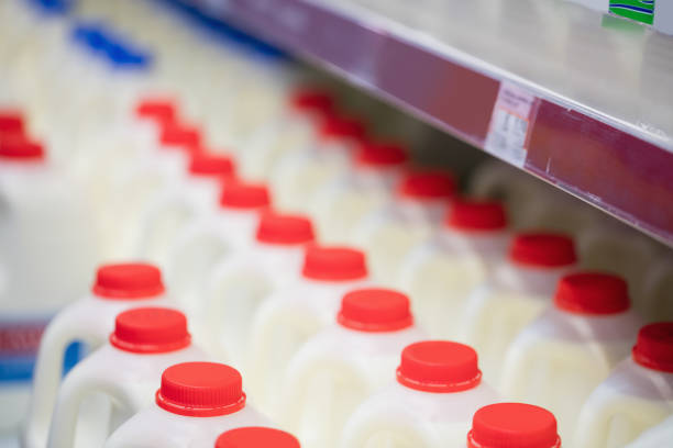 istock Milk bottles tidied in shelf 664095786