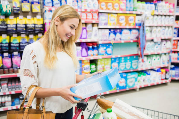 istock Smiling woman walking with trolley 664095902