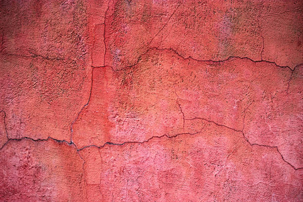 istock Red cement texture, concrete surface of the wall, colored background 664095914