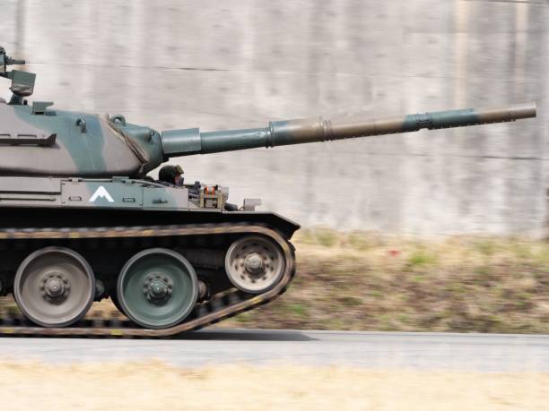 istock panning shot of moving tank 664098778