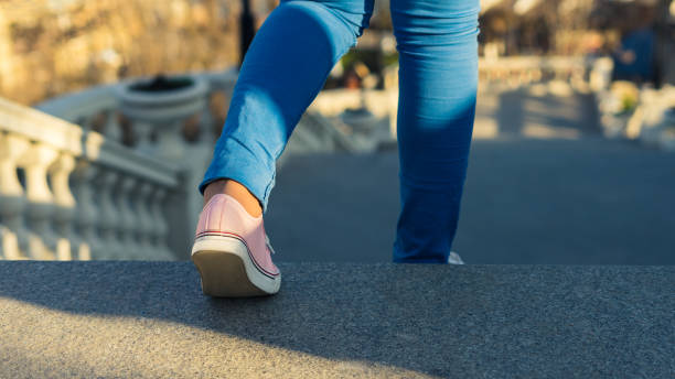 istock Young girl is walking downstairs on ladder. 664103768