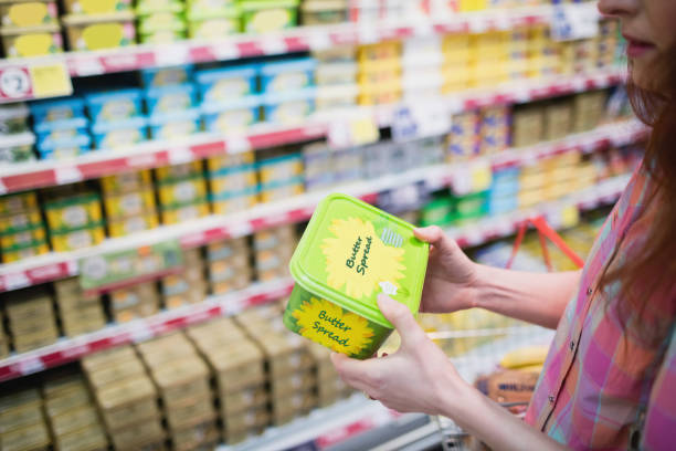 istock Close up view of hands holding butter 664103870