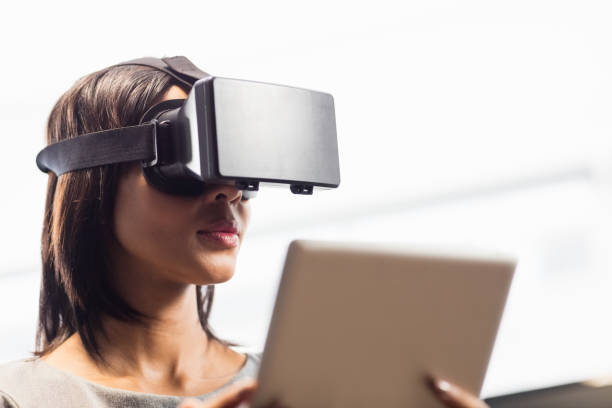 istock Businesswoman looking her tablet while using a virtual glasses 664118490