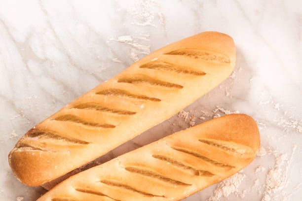 istock Freshly baked loaves of white bread with copyspace 664122788