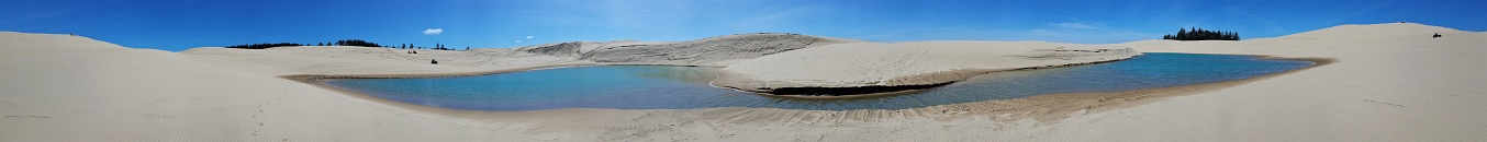 Sand dunes with water hole