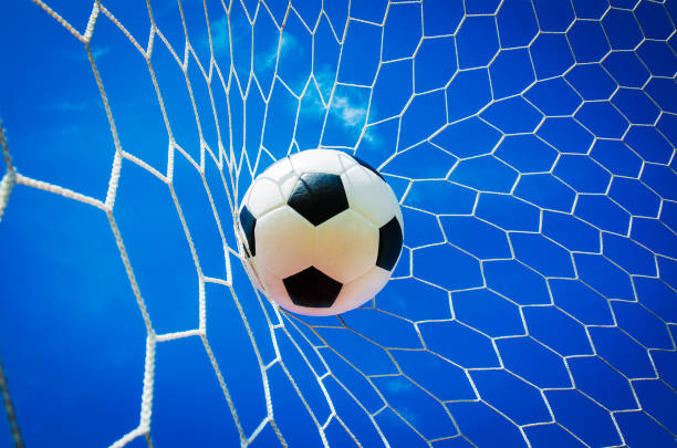 istock soccer ball in goal 664135182