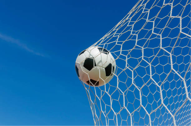 istock soccer ball in goal 664135222