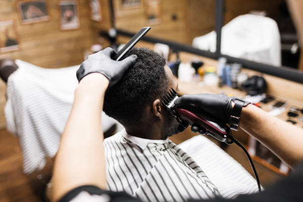 Job of barber Barber with comb and clipper doing his work glove box stock pictures, royalty-free photos & images