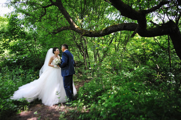 istock beautiful wedding couple at the forest 664155878