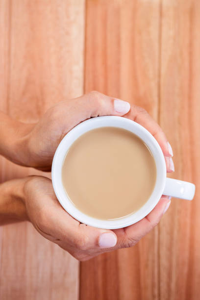 istock Womans hands holding cup of coffee 664156780