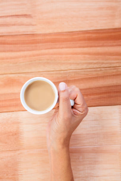istock Woman hands holding cup of coffee 664157272