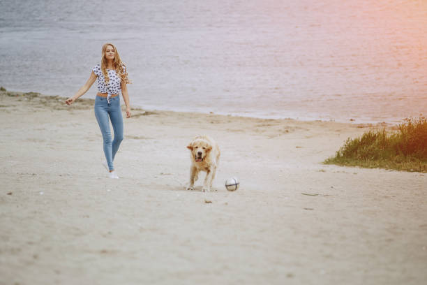 istock couple walking outdoors with her dog 664157362