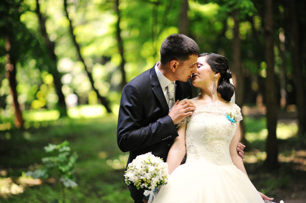 istock Groom kissing bride 664160032