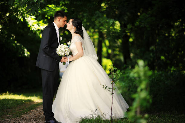 istock happy wedding couple at the forest 664160168