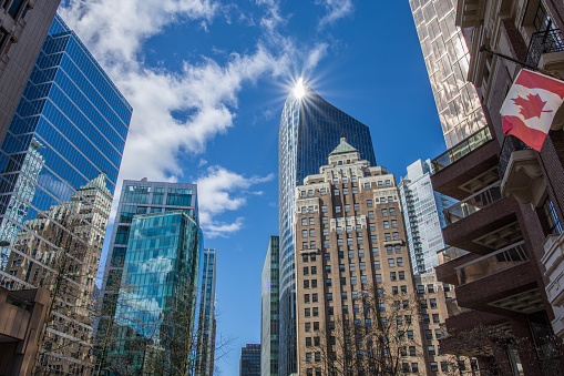 Low angle cityscape on a sunny spring day, showing various high rise office buildings
