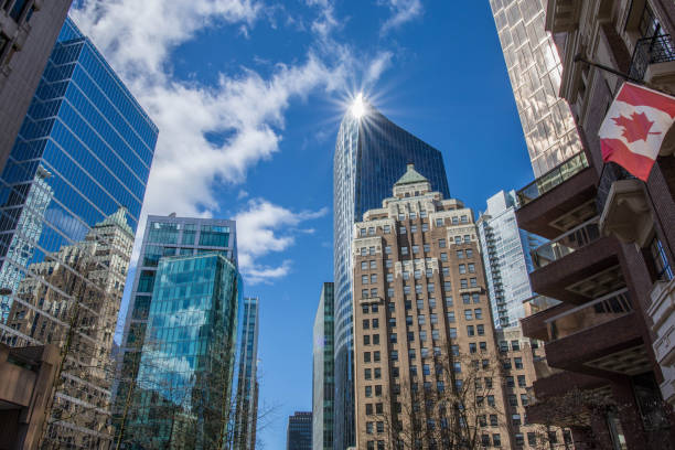 Urban Scene Low angle cityscape on a sunny spring day, showing various high rise office buildings vancouver canada stock pictures, royalty-free photos & images