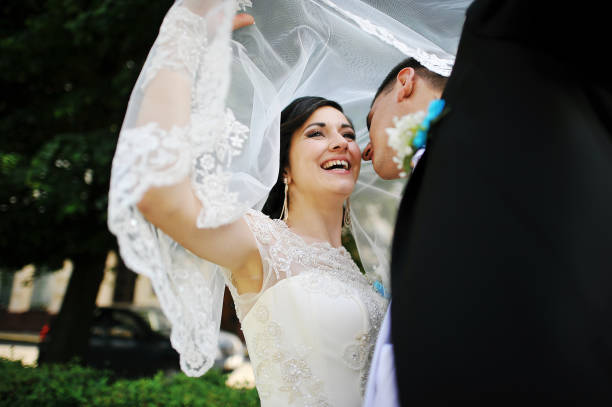istock Wedding couple under the veil 664160408
