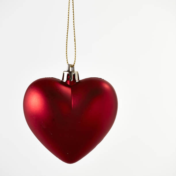 istock Red Heart Christmas Decoration on White 664167392