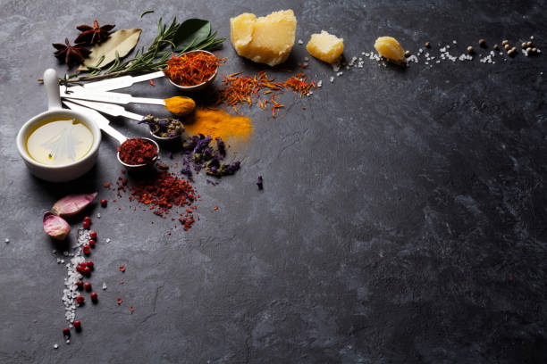 istock Herbs and spices over black stone 664169528