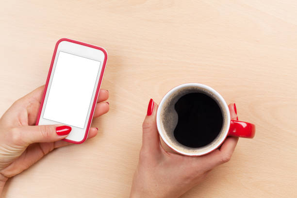 istock Female holding smartphone and coffee cup 664169902