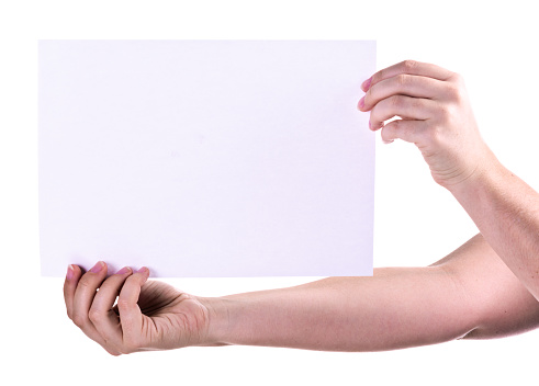 A woman's hands hold out an A4 sheet of  textured white  paper against a white background.