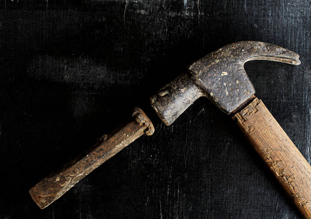 istock Hammer and Chisel steel on grunge wood backgrounds 664170866