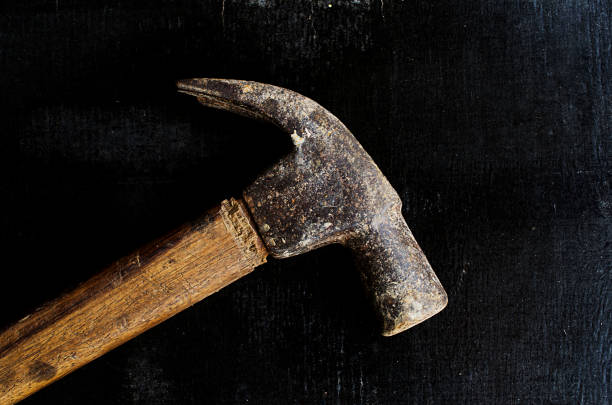 istock Close up of Hammer on woodworking backgrounds 664170878