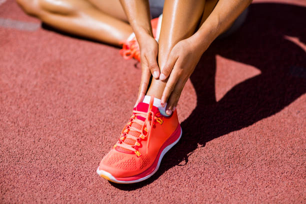 istock Female athlete warming up on the running track 664171554