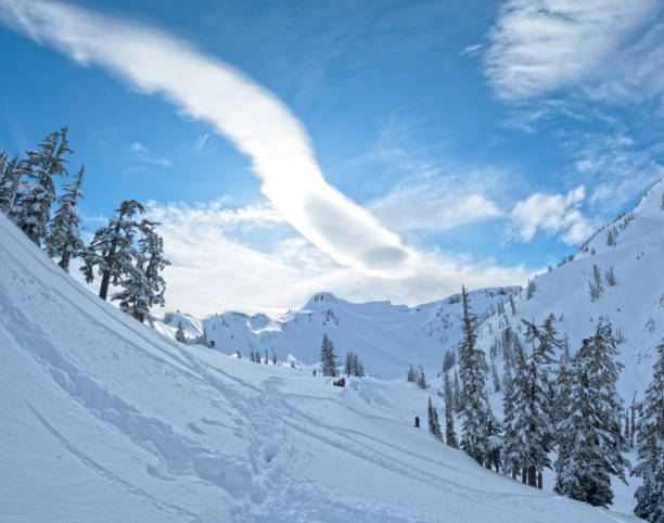 istock Lenticular Cloud Formation in the Sunny Winter Blue Skies 664174056
