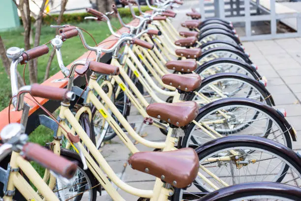 Photo of Closeup Yellow bicycles parking for rent