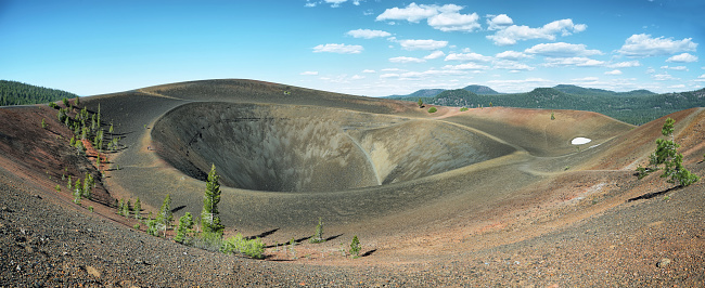 Landscape with the Cinder Cone Rim in Lassen Volcanic National Park with Lassen Peak in the distance, California, USA.