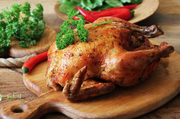 istock Whole roasted chicken on cutting board 664177050