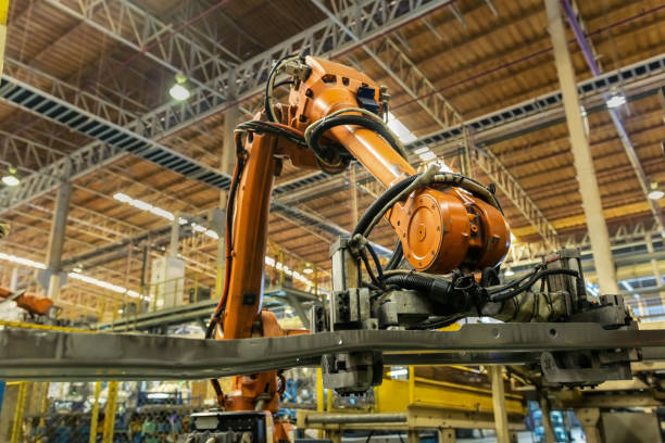 roboterarme behandeln toolpart halten automobil vor ort zerspanbar - automobile industry metal industry in a row gear stock-fotos und bilder