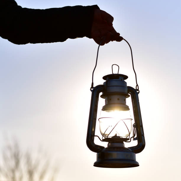 istock an oil lamp at the sundown landscape 664178412