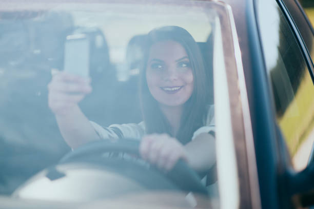 istock Young woman sitting in the car 664181542