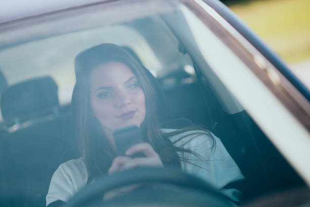 istock Young woman sitting in the car 664181548