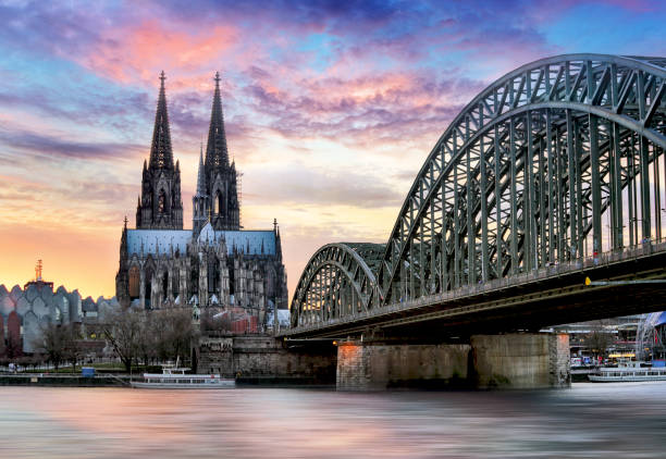 istock Cologne Cathedral and Hohenzollern Bridge at sunset - night 664182816