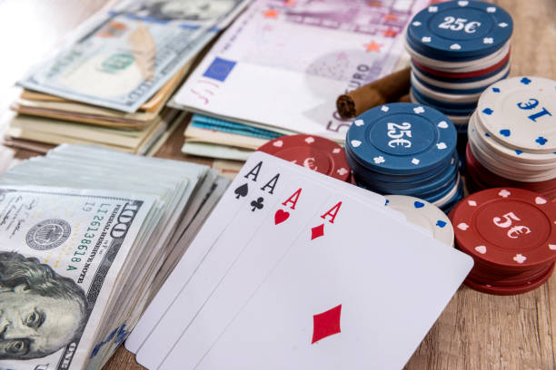 istock poker combinations - chips, paly card, money on desk. 664183078