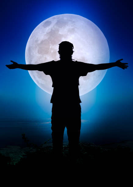 istock Silhouette of child enjoying and jumping at riverside. 664183134