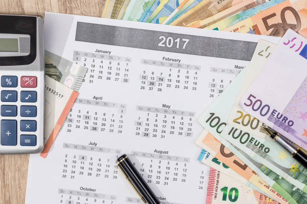 istock different euro bills with 2017 calendar and pen. 664183446