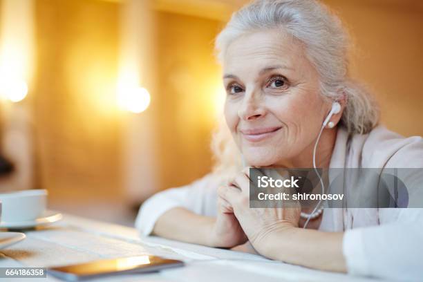 Enjoying Music Stock Photo - Download Image Now - Music, Senior Adult, Women