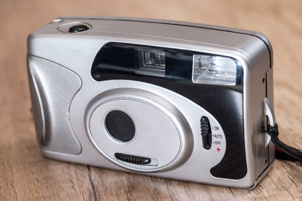 istock Old camera on wooden background. close up. 664186382