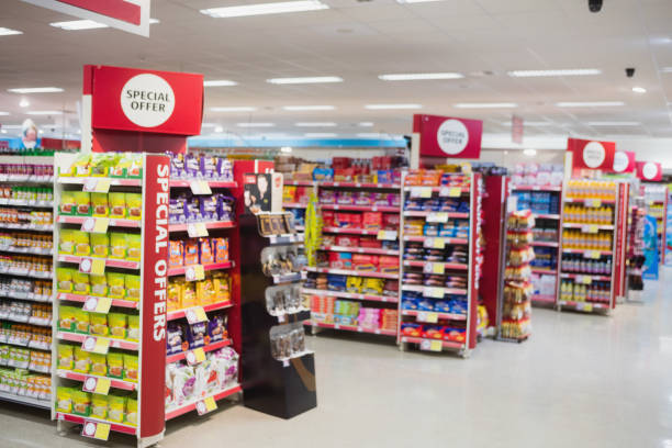 Photograph of shelves with promotions Photograph of shelves with promotions in a supermarket aisle stock pictures, royalty-free photos & images