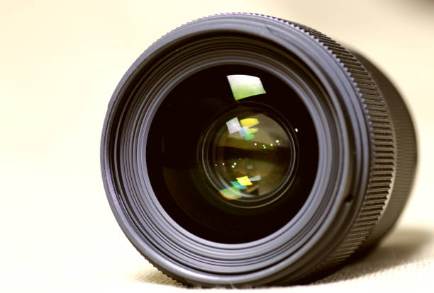 istock toned monochrome background of lens flare object 664188972