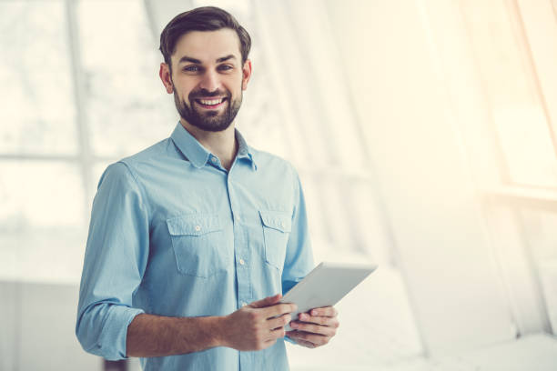 istock Handsome businessman in office 664194648
