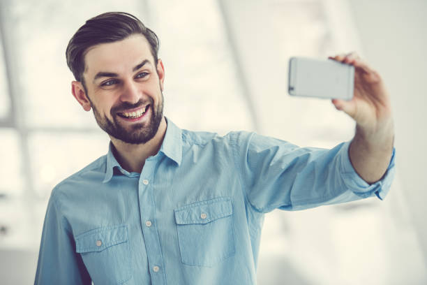 istock Handsome businessman in office 664194660