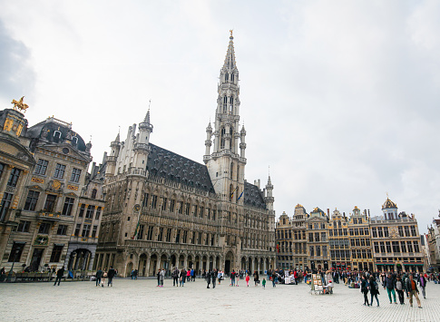 Unidentified people at the City Hall at the Grand Place in the center of Brussels, Belgium.