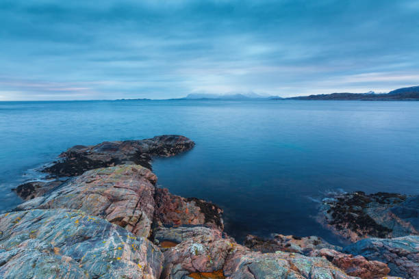 Kristiansund is build on four islands. On the biggest Island which is called Kirkelandet, where also the city center is located. This island has a part which is called kleppen. from there the picture was taken. towards north east. the sea is the Atlantic and the mountain at the horizon is in reality a mountain range and belongs the the island called tustna.