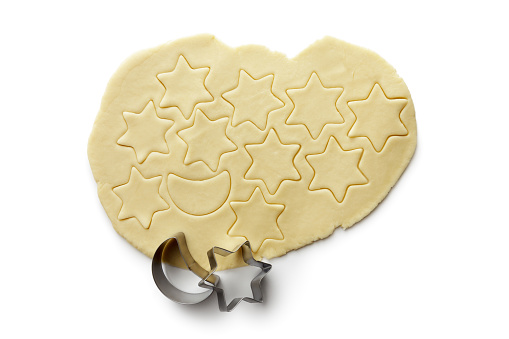 Woman making gingerbread man with cutter at table, closeup. Homemade Christmas biscuits