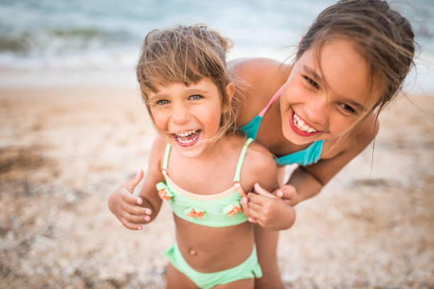 Kids having fun in water outdoors. 